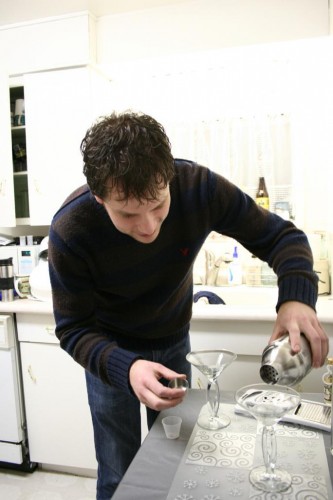 Meanwhile, as the cheese cooked, Grant poured gin -- with a hint of vermouth, and shaken, not stirred -- into the glasses, readying the drinks for their covering crown of cheese.