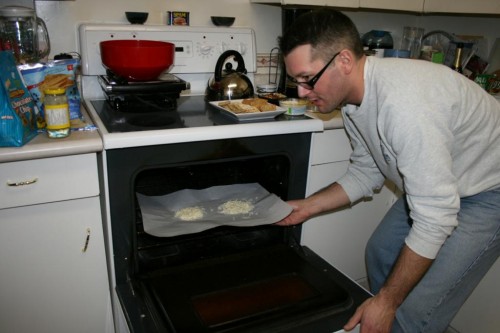 Okay, the cheese looks ready. Two flat, round piles of shredded mozzarella. Let's put it in!